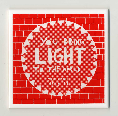 'You Bring Light' Ceramic Tile available in 4 different colours.  Red, Blue, Orange or Honeycomb.